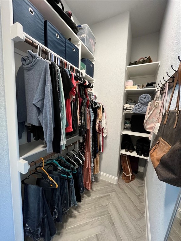 16664 County Road 3120 Road Northwest Purdon, TX 76679 - Photo 45 of 59 a view of walk in closet with clothes and shoes