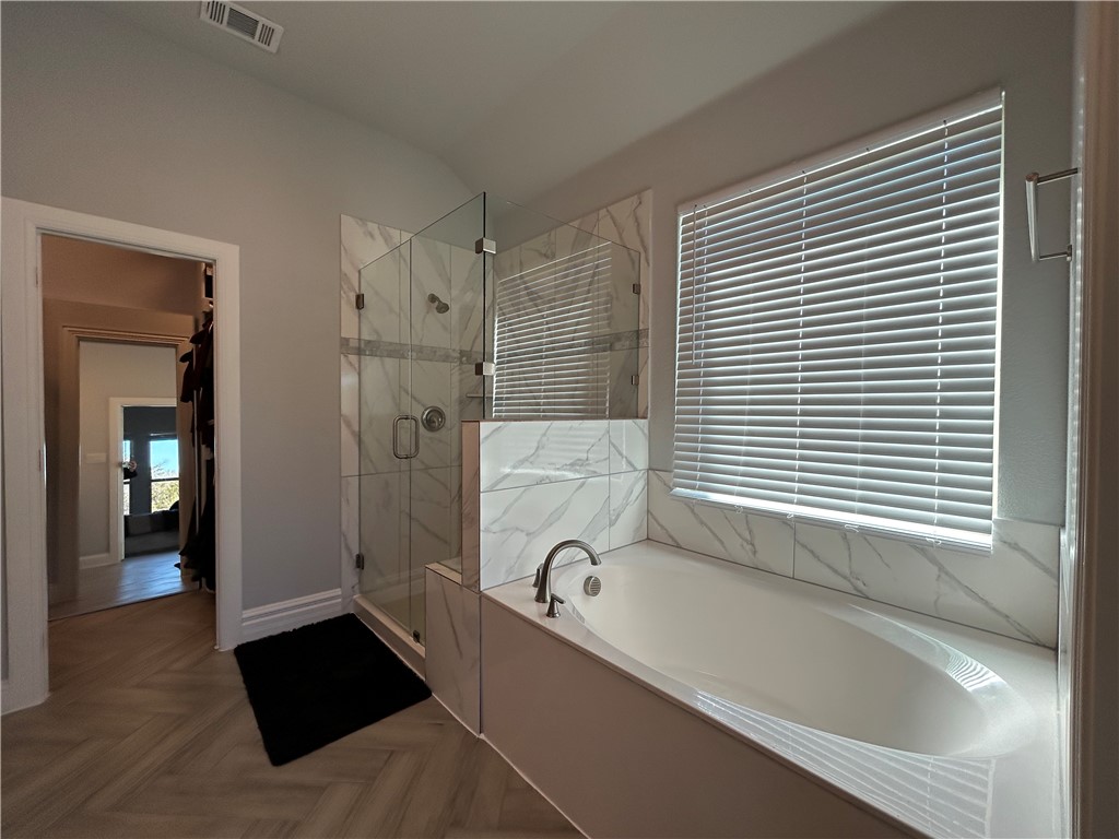 16664 County Road 3120 Road Northwest Purdon, TX 76679 - Photo 5 of 59 a bathroom with a bathtub and a shower