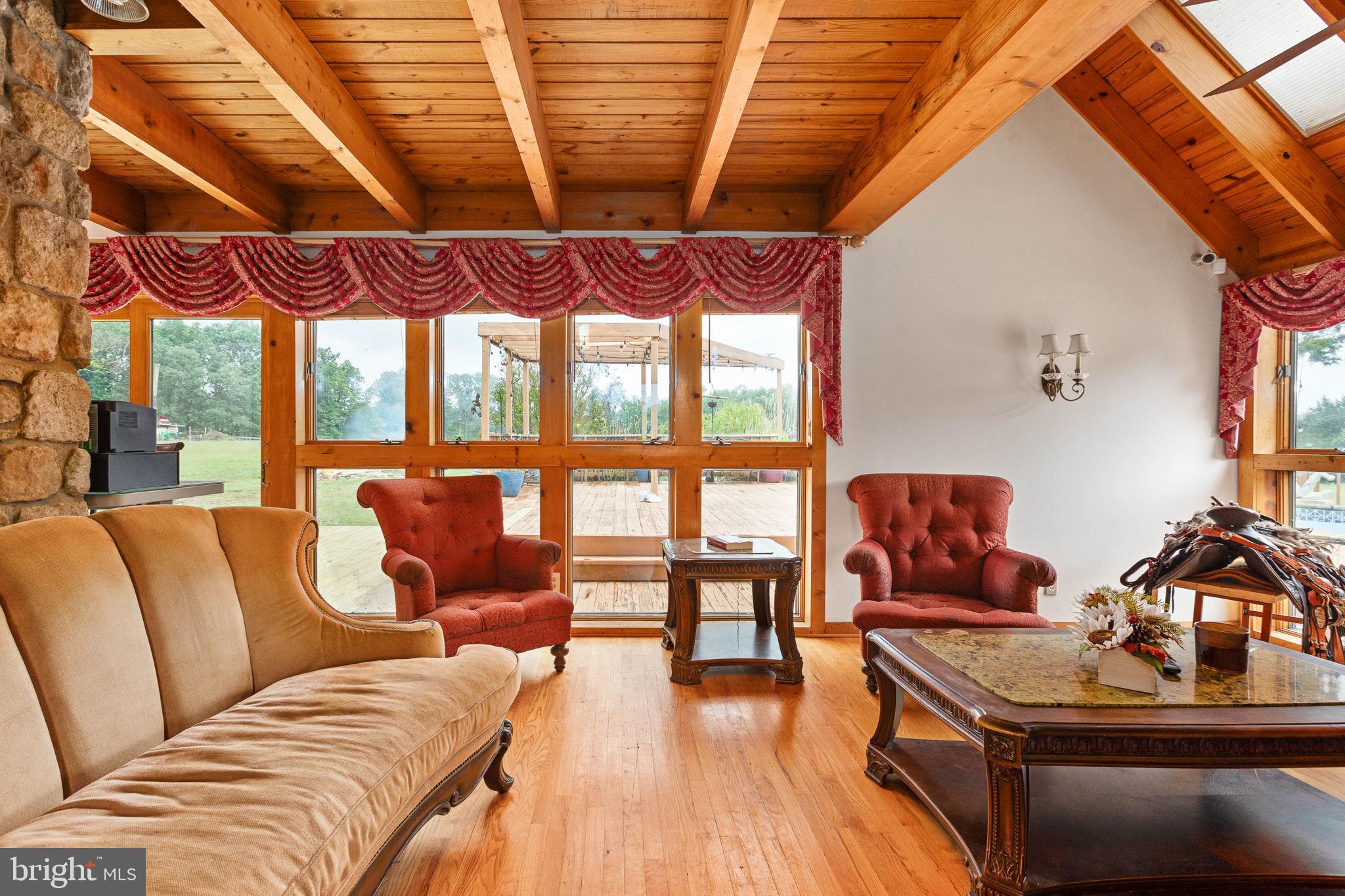 6119 Beach Road Midland, VA 22728 - Photo 17 of 98 a living room with furniture and a floor to ceiling window