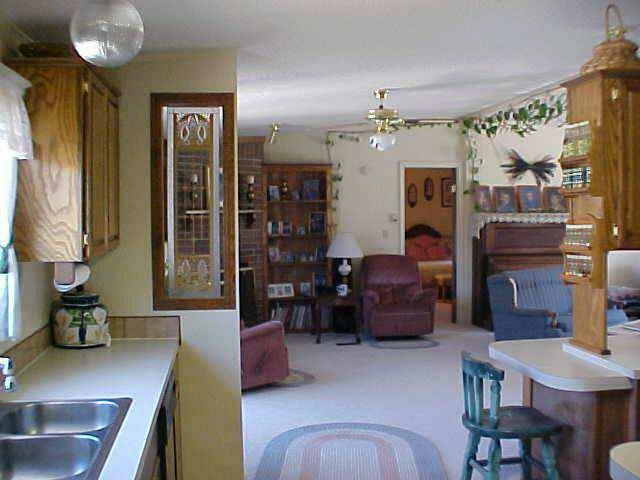 17731 G Road Cortez, CO 81321 - Photo 5 of 9 a living room with furniture and a chandelier
