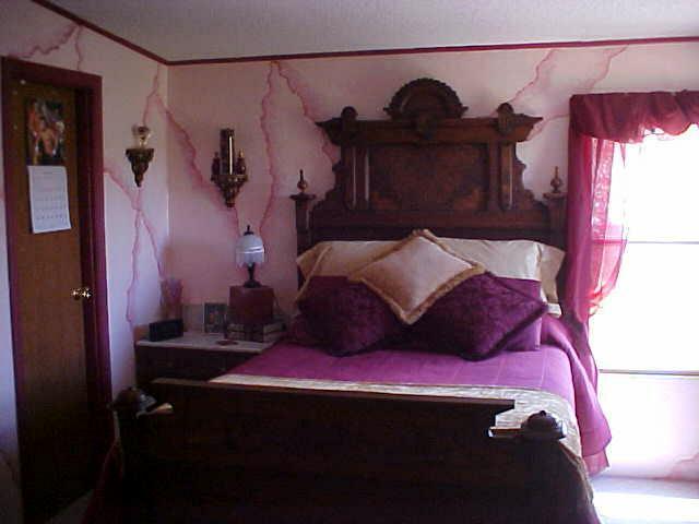 17731 G Road Cortez, CO 81321 - Photo 7 of 9 a bedroom with a bed and a mirror