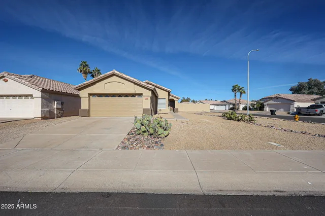 a view of a house with a street