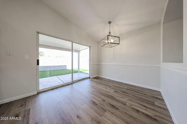 a kitchen with stainless steel appliances a refrigerator and a stove top oven