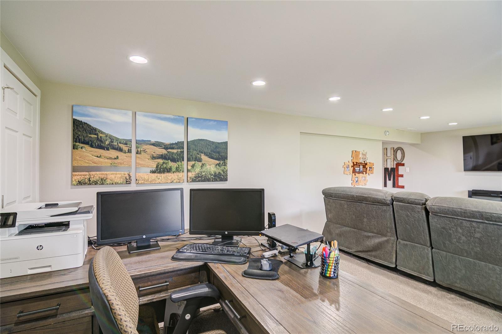 4531 East Best Road Larkspur, CO 80118 - Photo 27 of 49 a workspace with furniture and a flat screen tv