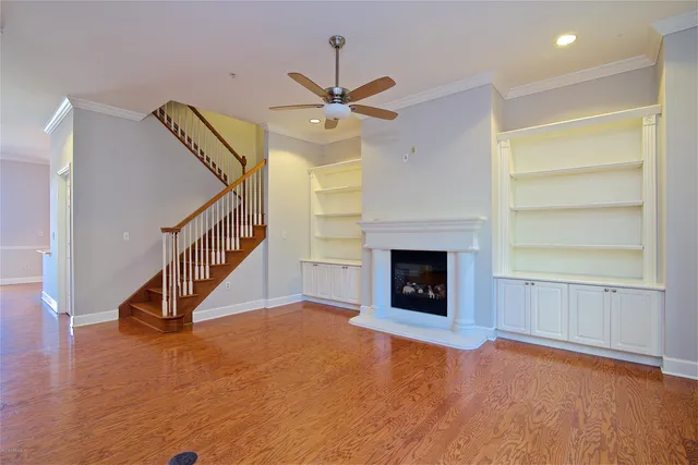 a open kitchen with stainless steel appliances granite countertop a refrigerator stove top oven and sink