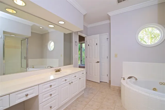 a view of a house with backyard sitting area and fire pit