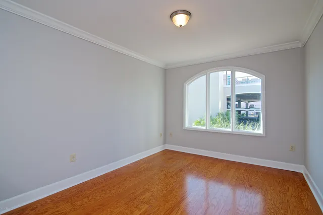 a kitchen with granite countertop a stove a sink and a wooden cabinets