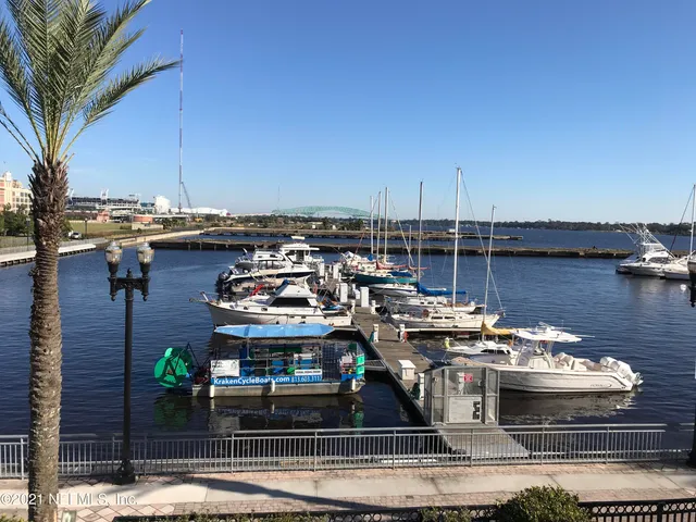 a living room with furniture a rug and a fireplace