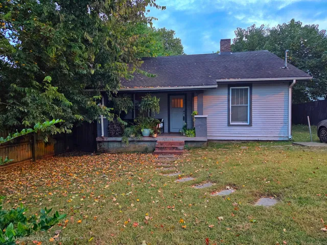 a swimming pool with wooden fence