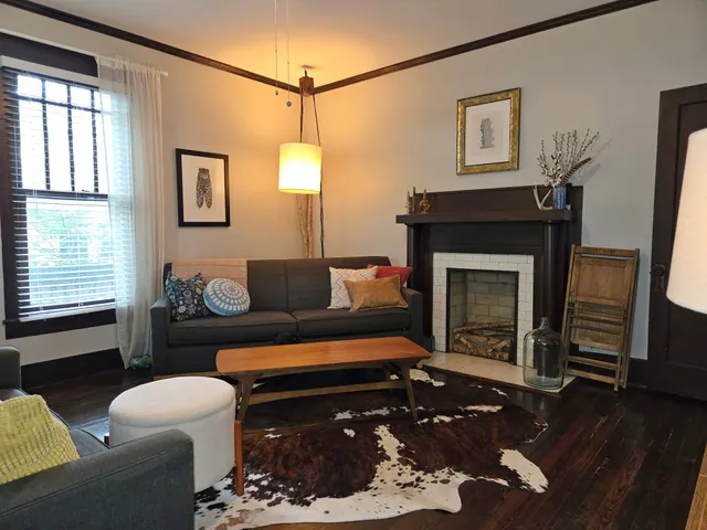 a dining room with furniture and window