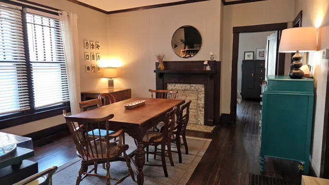 a view of a dining room with furniture and window