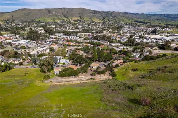 a view of a town with mountains in the background