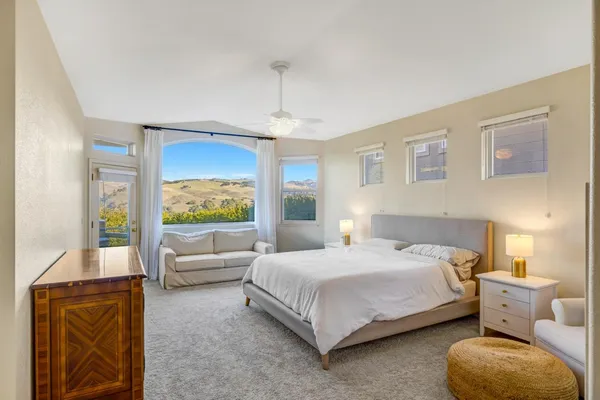 a bedroom with a bed and a couch