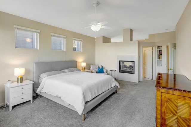 a spacious bedroom with a bed and a couch