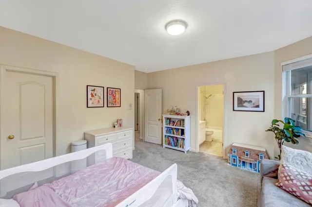 a bedroom with a bed and furniture