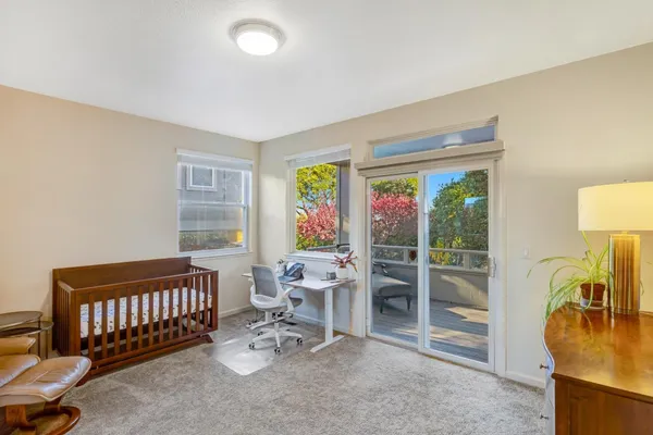 a view of a livingroom with furniture and a window