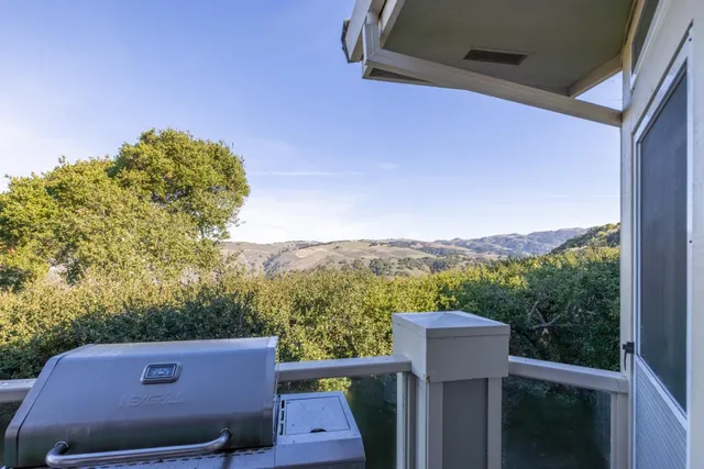 a view of a balcony with furniture