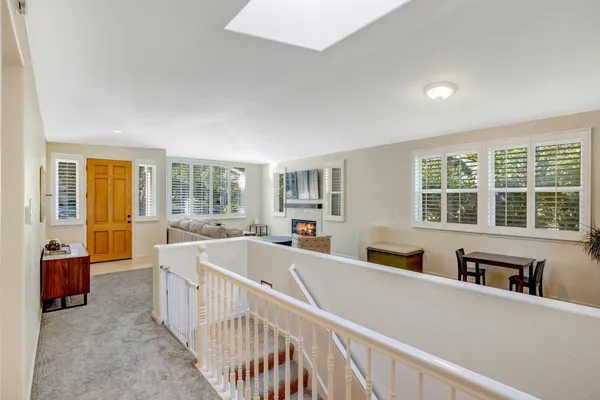 a view of a living room and a large window