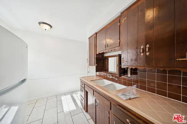 a bathroom with a sink a vanity and a mirror