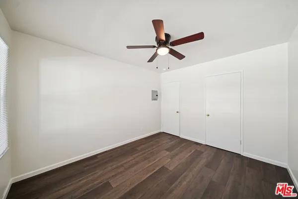a view of a big room with wooden floor
