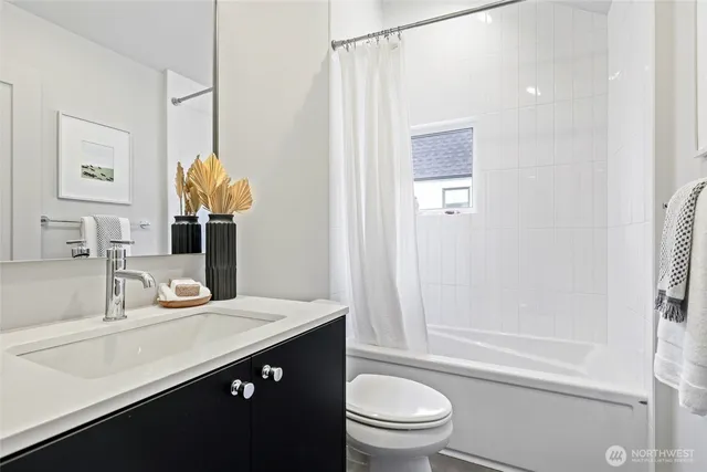 a bedroom with a bed and a table