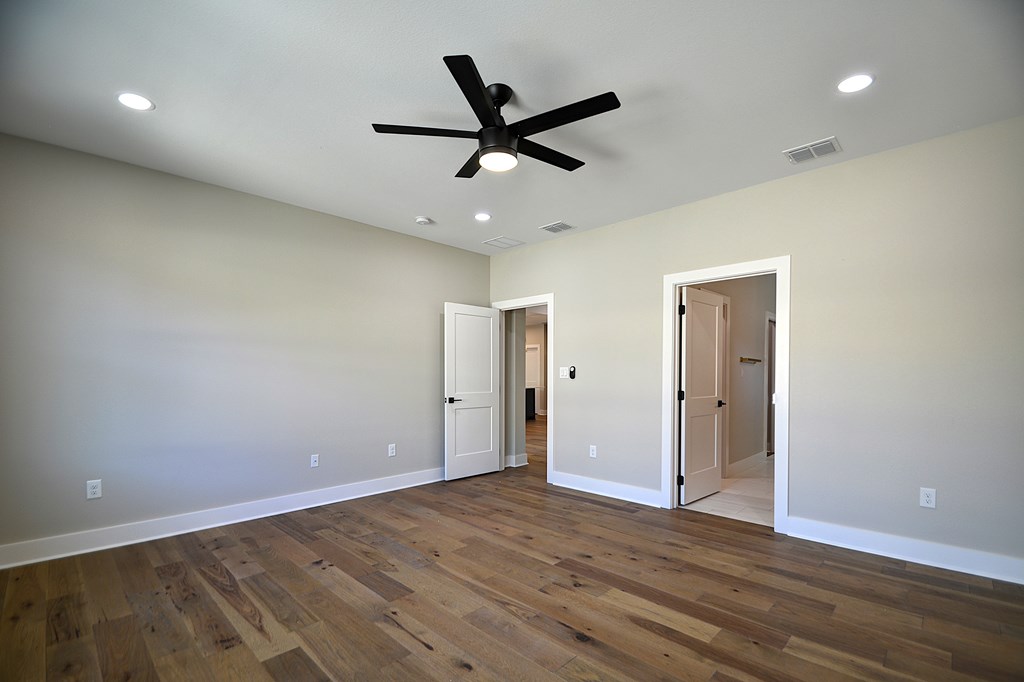 1806 Chateau Kerrville, TX 78028 - Photo 18 of 44 a view of an empty room with a ceiling fan