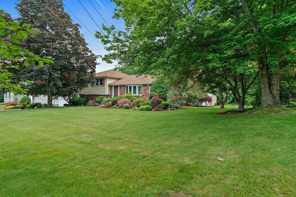 4 Kings Road Canton, MA 02021 - Photo 2 of 33 a view of house with garden space and trees