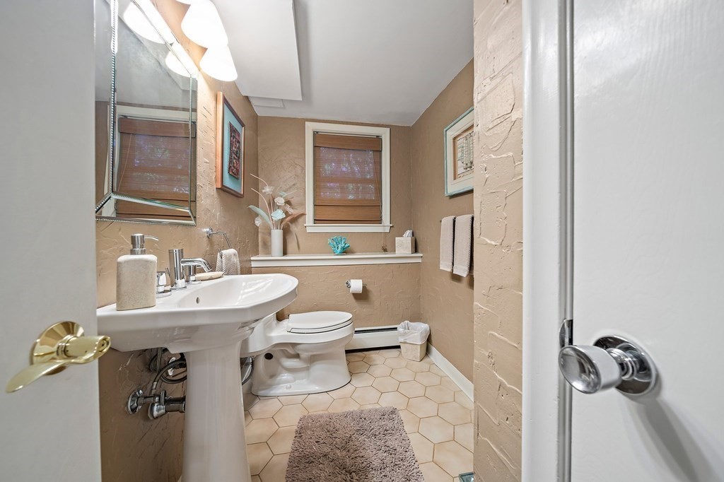 4 Kings Road Canton, MA 02021 - Photo 21 of 33 a bathroom with a sink toilet a mirror and shower
