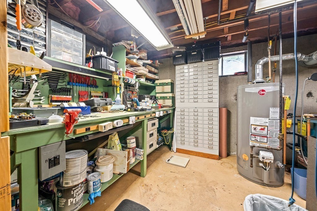 4 Kings Road Canton, MA 02021 - Photo 23 of 33 a utility room with lots of wooden cabinets