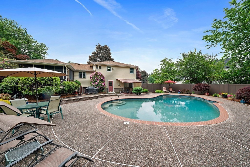 4 Kings Road Canton, MA 02021 - Photo 30 of 33 a roof deck with table and chairs under an umbrella