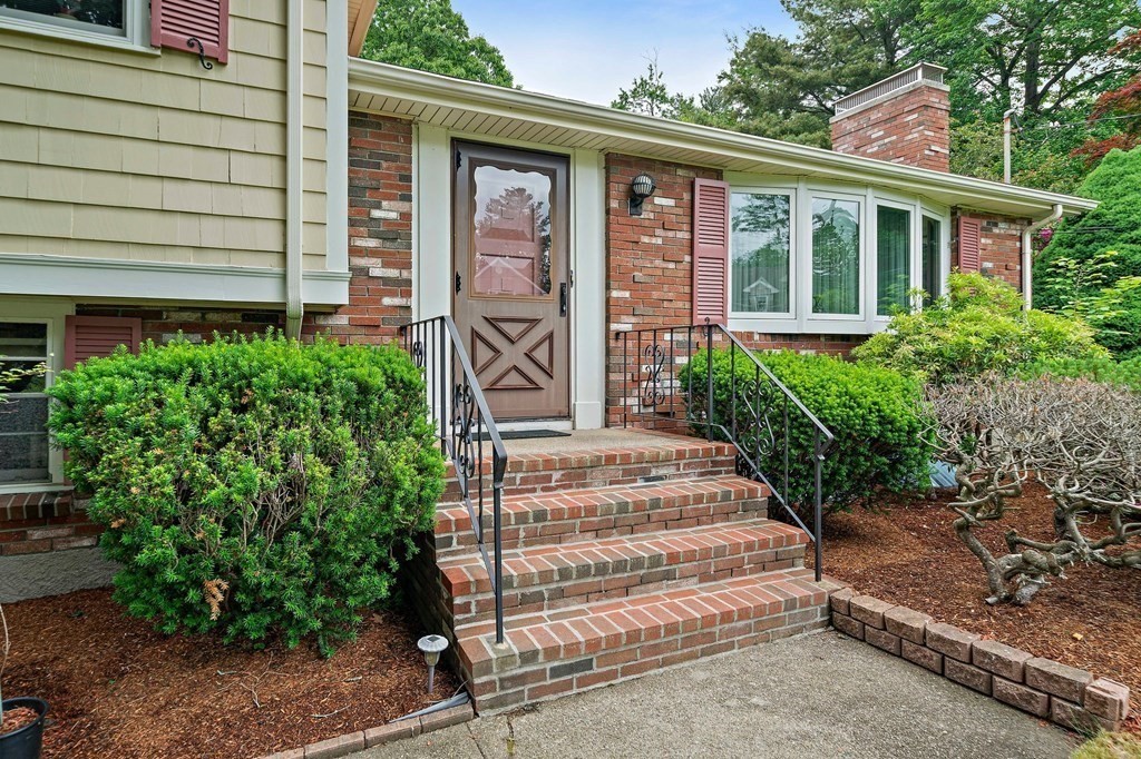 4 Kings Road Canton, MA 02021 - Photo 3 of 33 a view of a house with potted plants