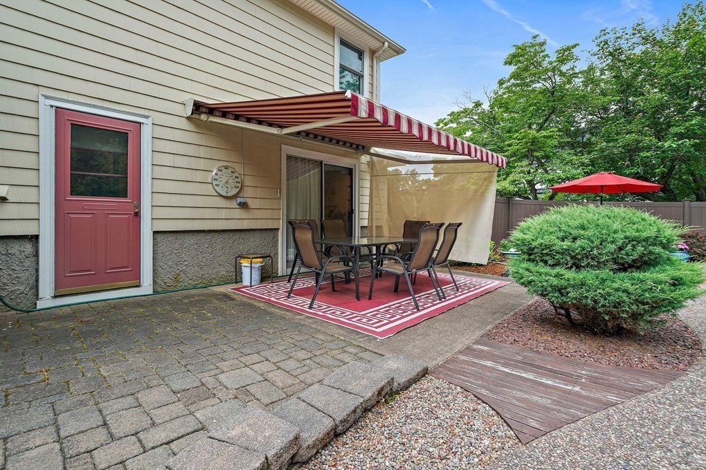 4 Kings Road Canton, MA 02021 - Photo 31 of 33 a view of a dinning tables and chairs in the patio