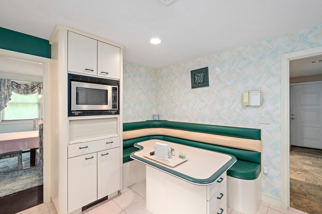 4 Kings Road Canton, MA 02021 - Photo 6 of 33 a bathroom with a sink and a microwave