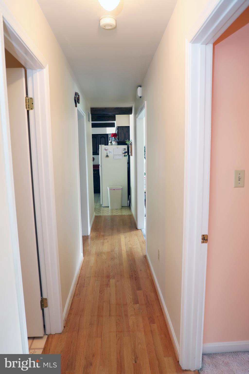 7839 Ridge Road Frederick, MD 21702 - Photo 27 of 63 Hardwood floors outline "L " shape Long hallway .