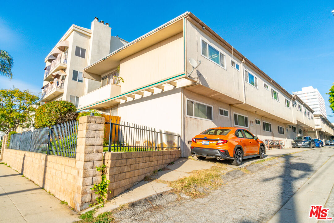 1256 South Westgate Avenue Los Angeles, CA 90025 - Photo 3 of 11 a car parked in front of a building