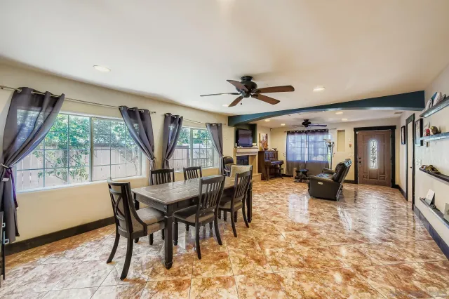 a view of a dining room with furniture window and outside view