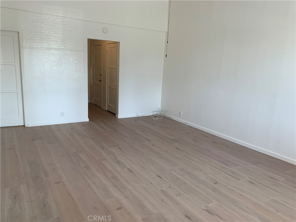 403 Cajon Street, Unit 5 Redlands, CA 92373 - Photo 6 of 16 a view of an empty room with wooden floor