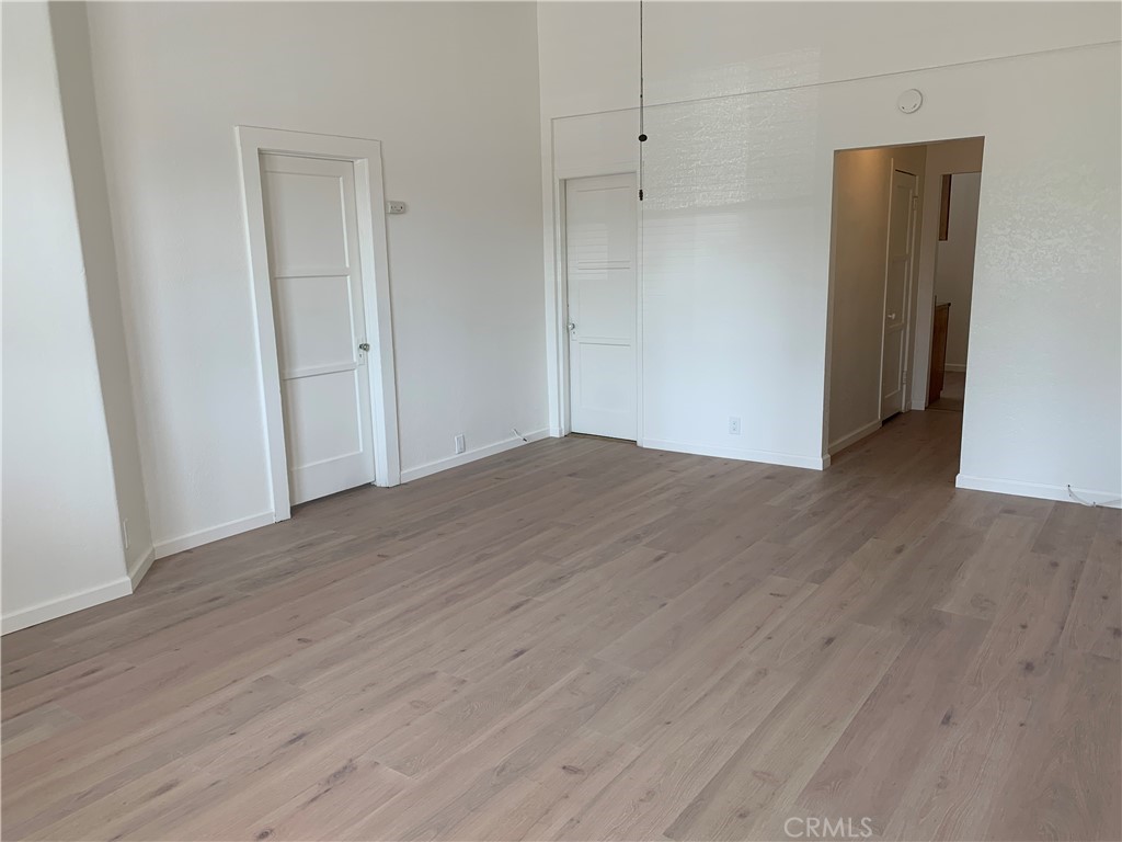 403 Cajon Street, Unit 5 Redlands, CA 92373 - Photo 10 of 16 a view of an empty room with wooden floor