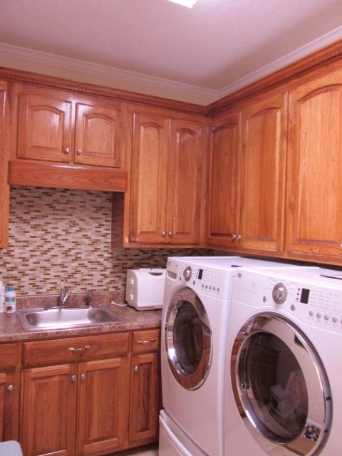 136 Barbara Spears Road Morrison, TN 37357 - Photo 14 of 26 The laundry room has a sink and plenty of storage.