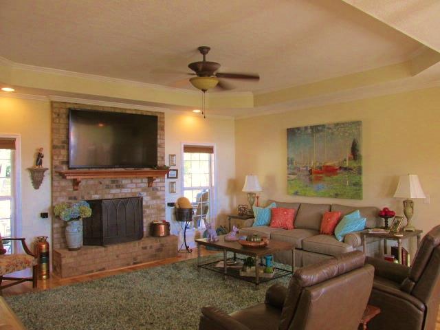 136 Barbara Spears Road Morrison, TN 37357 - Photo 6 of 26 The wood burning rock fireplace and trey ceiling add warmth to the living room.