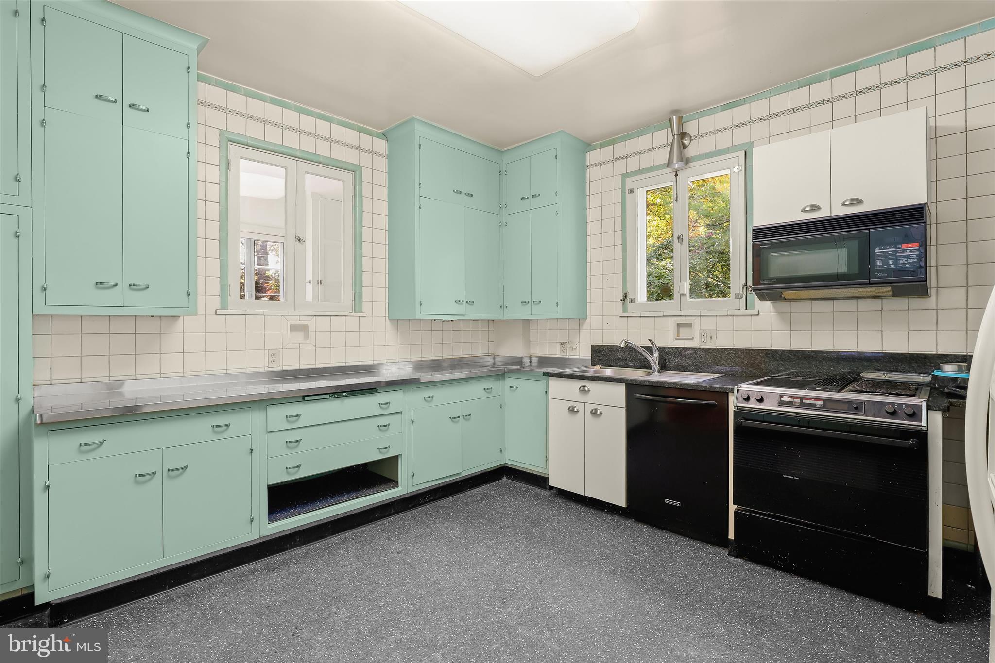 2209 Ken Oak Road Baltimore, MD 21209 - Photo 28 of 102 a kitchen with granite countertop cabinets stainless steel appliances and a sink
