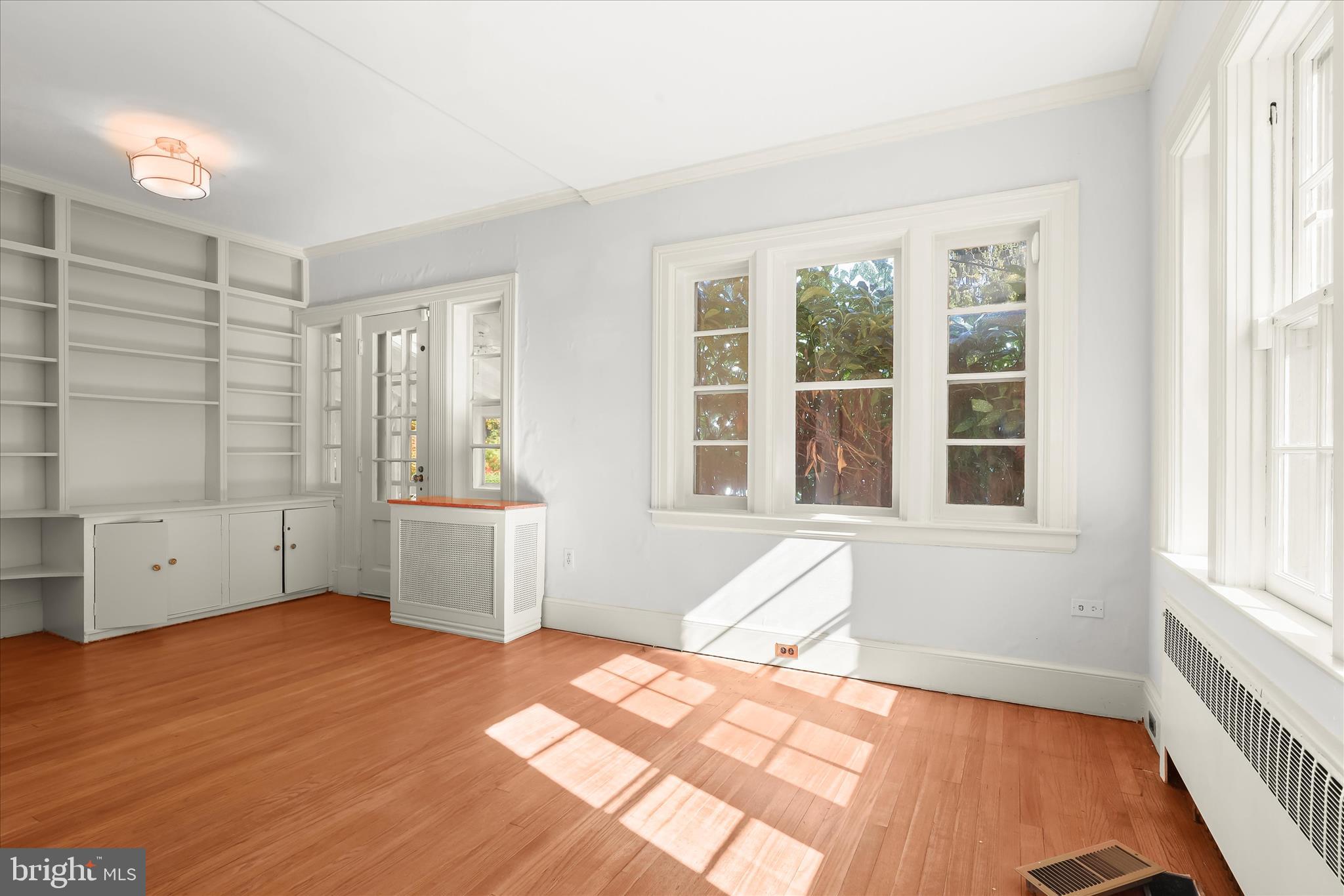 2209 Ken Oak Road Baltimore, MD 21209 - Photo 36 of 102 an empty room with windows and cabinet