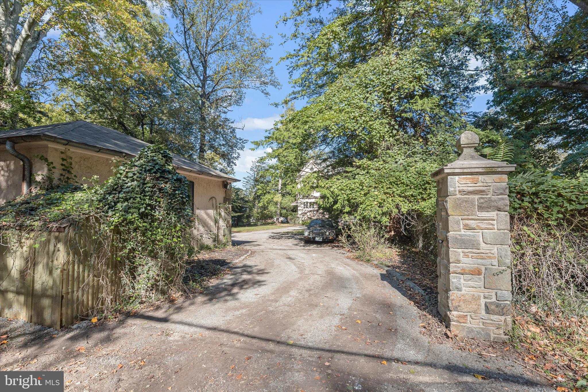 2209 Ken Oak Road Baltimore, MD 21209 - Photo 5 of 102 a pathway of a house with large trees