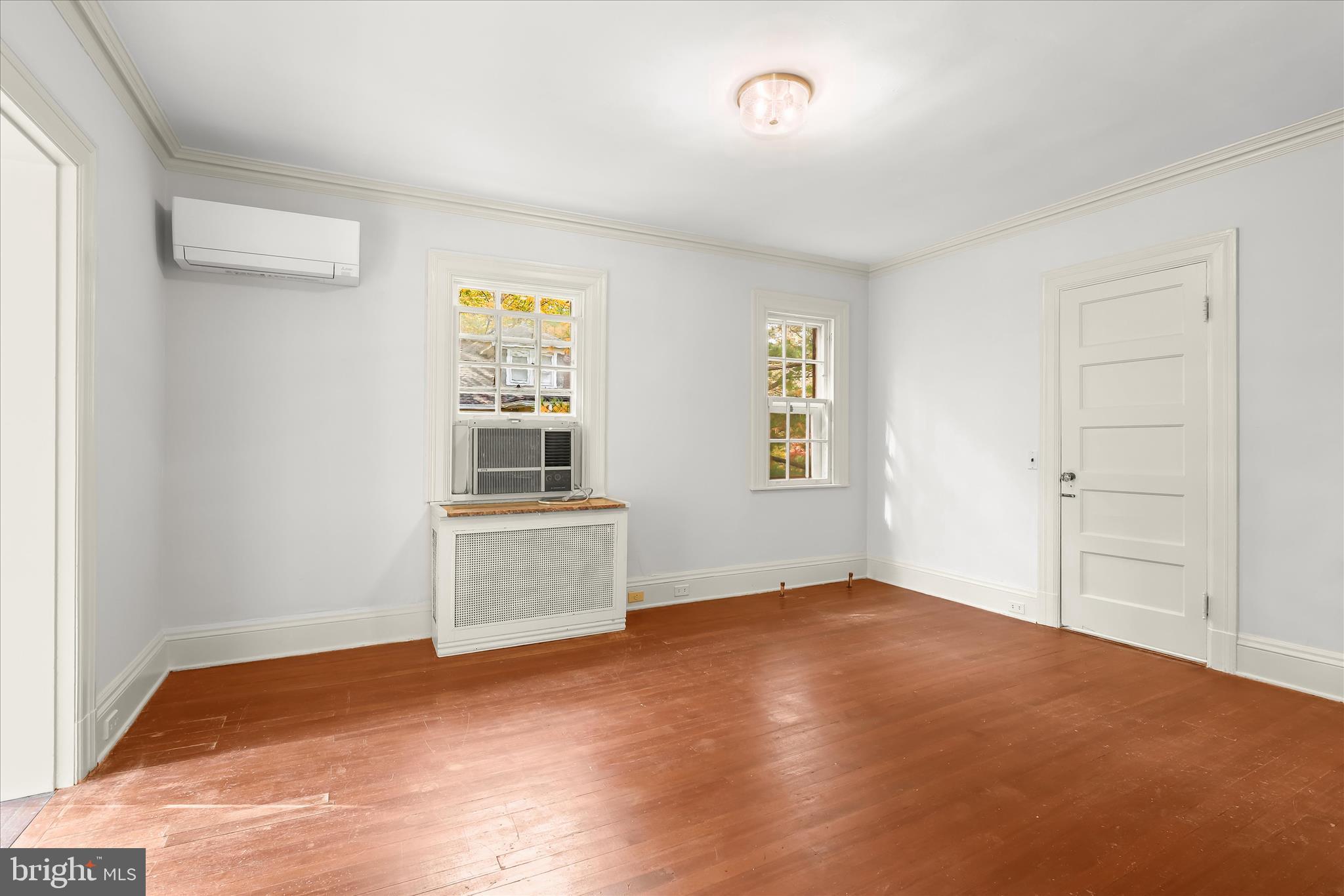 2209 Ken Oak Road Baltimore, MD 21209 - Photo 54 of 102 an empty room with windows and cabinet