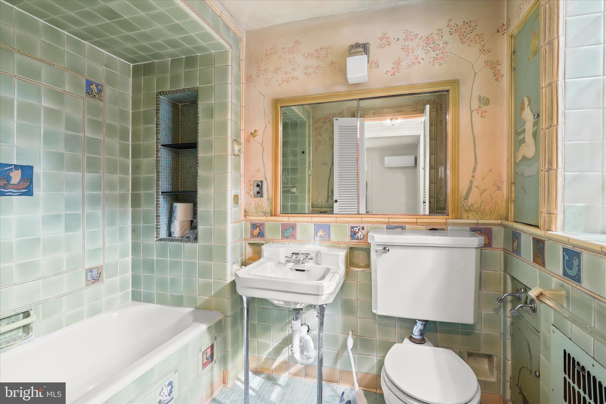 2209 Ken Oak Road Baltimore, MD 21209 - Photo 56 of 102 a bathroom with a sink vanity mirror and toilet