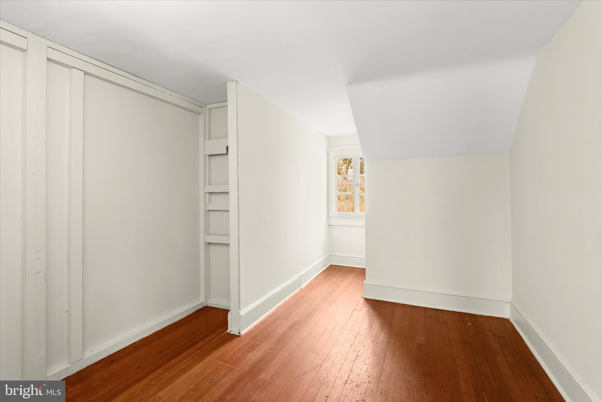 2209 Ken Oak Road Baltimore, MD 21209 - Photo 60 of 102 a view of an empty room with wooden floor