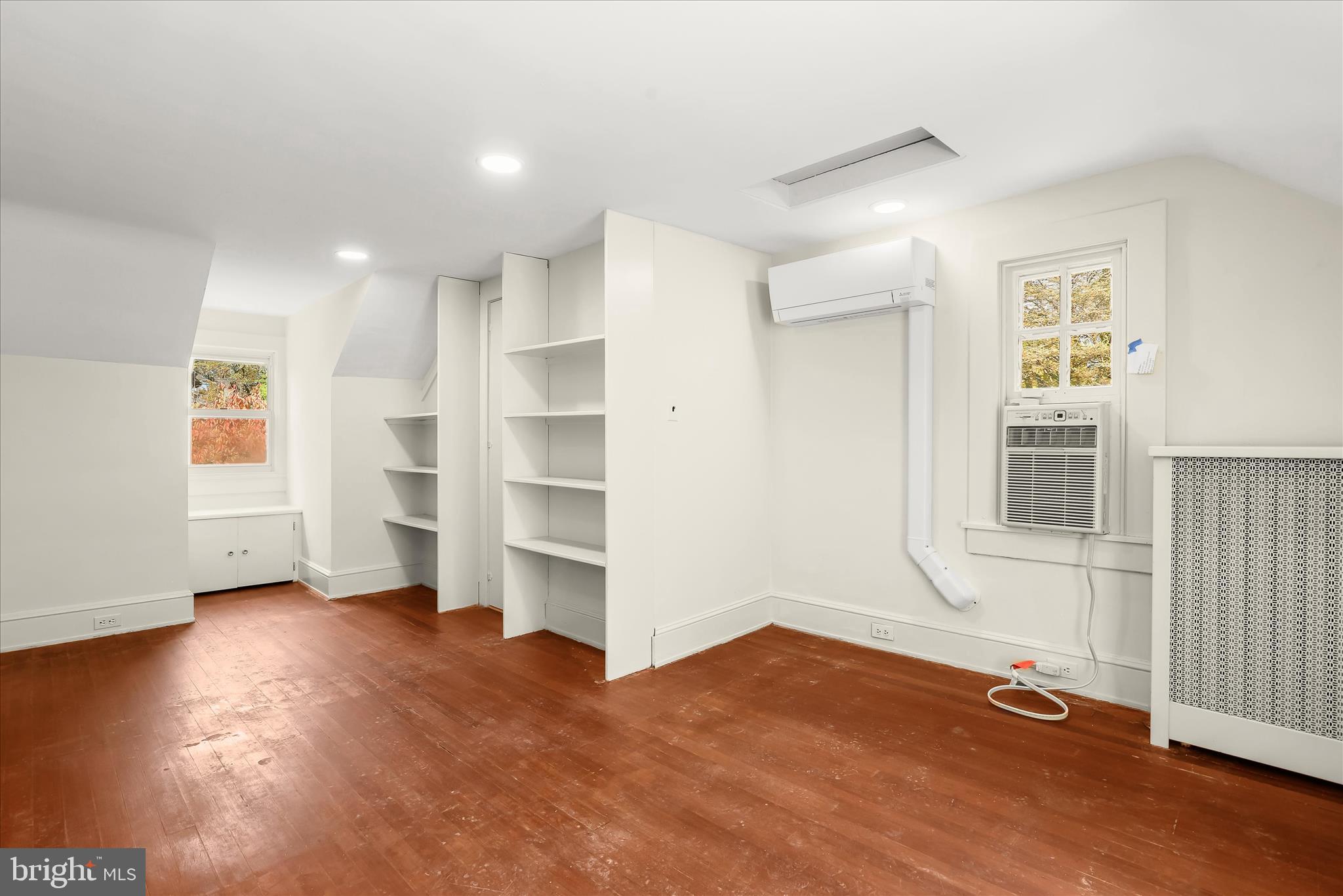 2209 Ken Oak Road Baltimore, MD 21209 - Photo 62 of 102 wooden floor in an empty room with a window