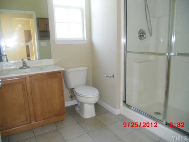 304 Hope Valley Road Knightdale, NC 27545 - Photo 8 of 19 a bathroom with a toilet sink and shower