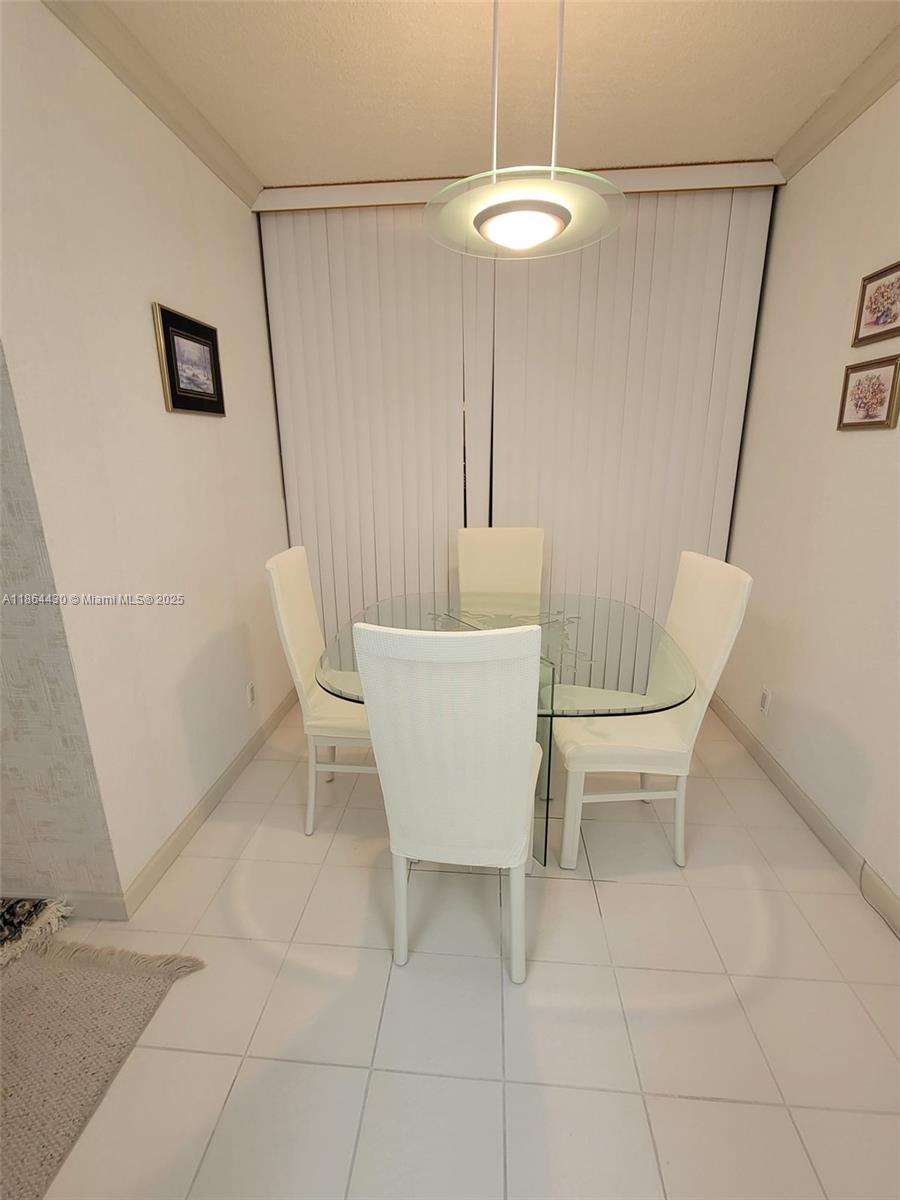 1000 West Island Boulevard, Unit 1511 Aventura, FL 33160 - Photo 13 of 41 a white bath tub sitting in a en suite bathroom