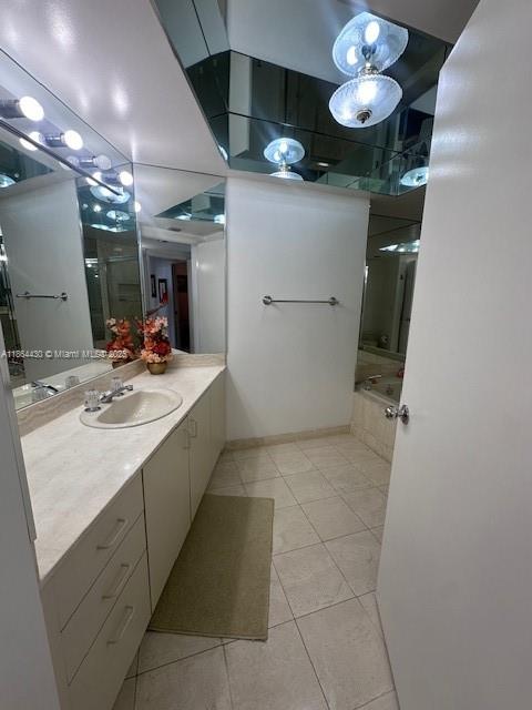 1000 West Island Boulevard, Unit 1511 Aventura, FL 33160 - Photo 18 of 41 a room with a sink a washer and dryer